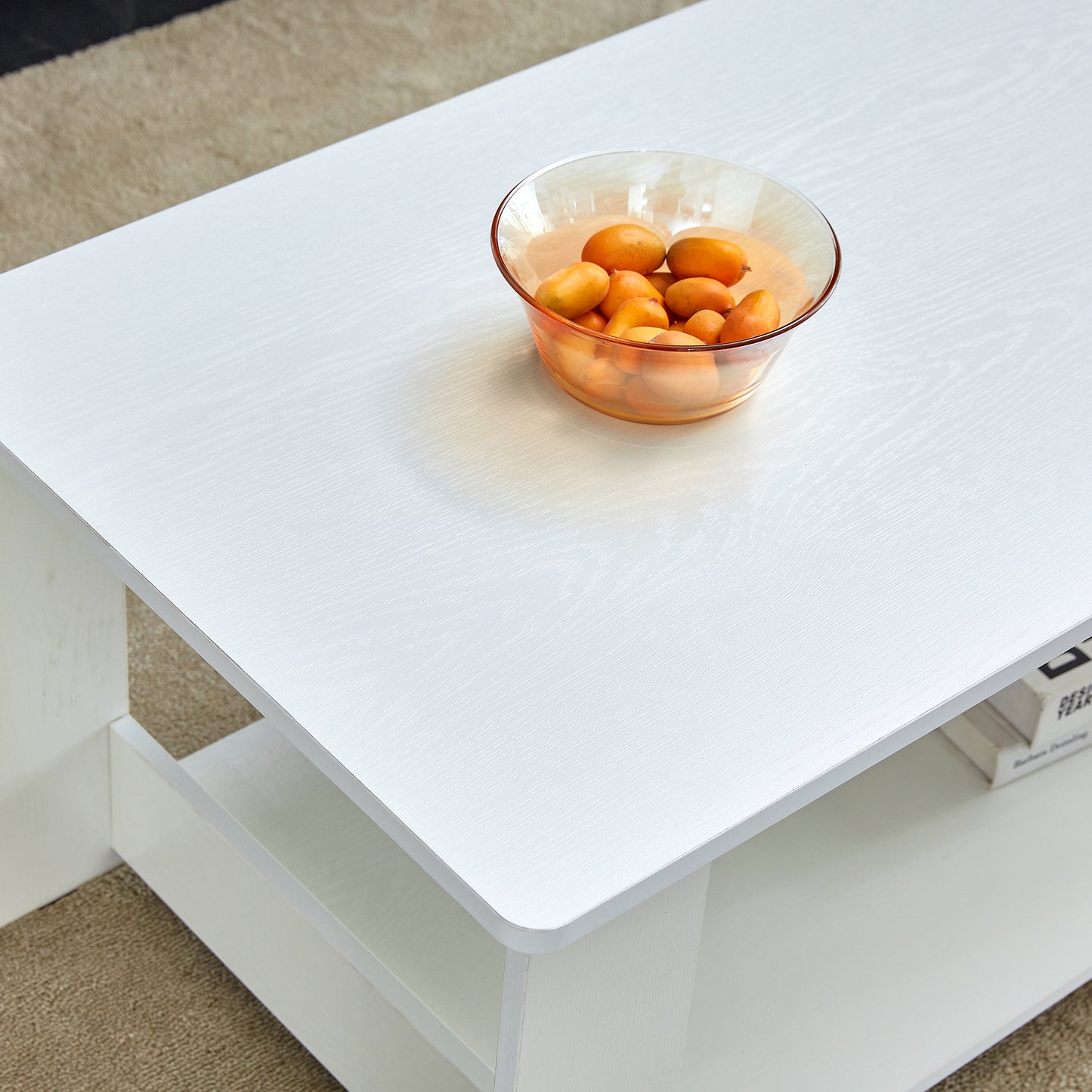 A modern and practical white coffee table. The double layered coffee table is made of MDF material,. Suitable for living room, bedroom, and study. CT-16