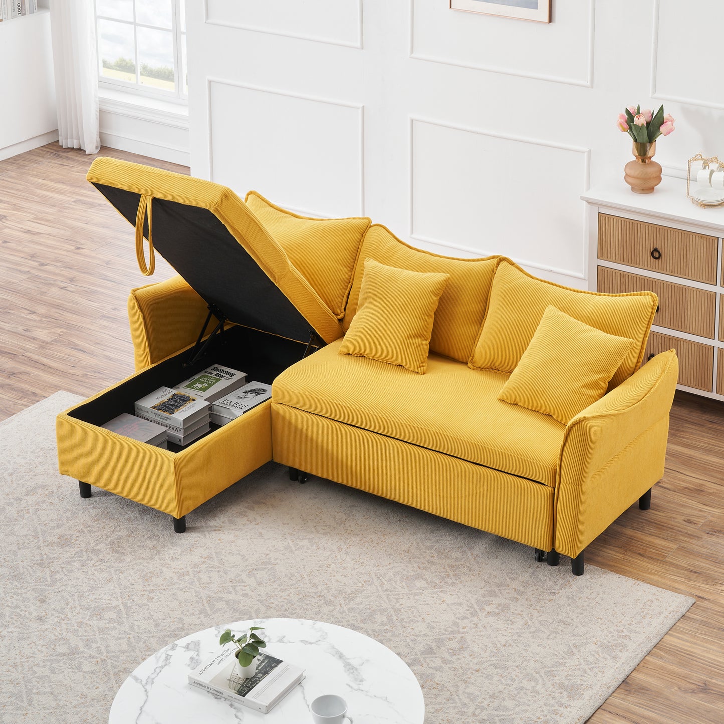 The 80-inch yellow corduroy L-shaped sofa comes with two small throw pillows that can be converted into a sofa bed for storage